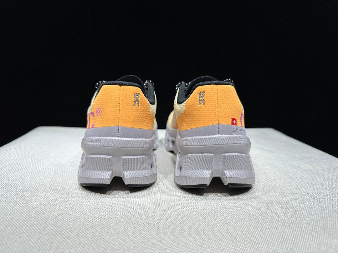 On Cloudmonster Running Shoes, in Pale Yellow and Orange - product image from the listing.
