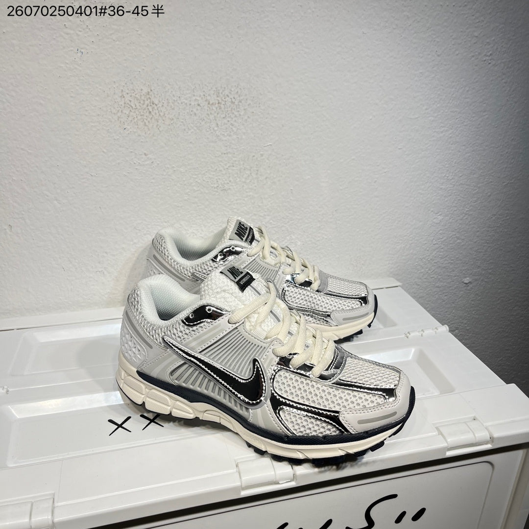 Nike Air Zoom Vomero 5 Sneakers, in White and Black - product image from the listing.