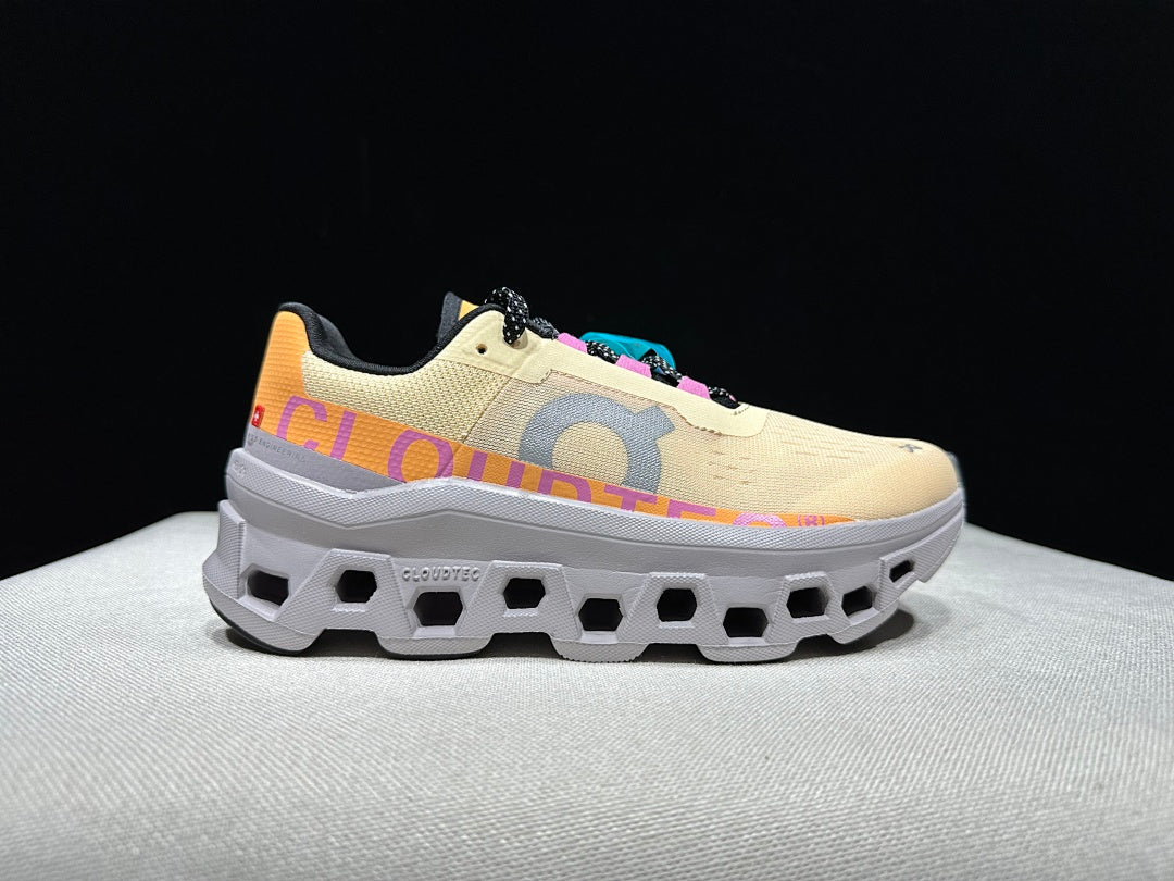 On Cloudmonster Running Shoes, in Pale Yellow and Orange - product image from the listing.