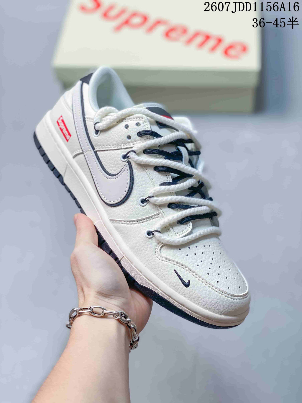 Nike SB Dunk Low Supreme Sneakers in Off-White - product image from the listing.