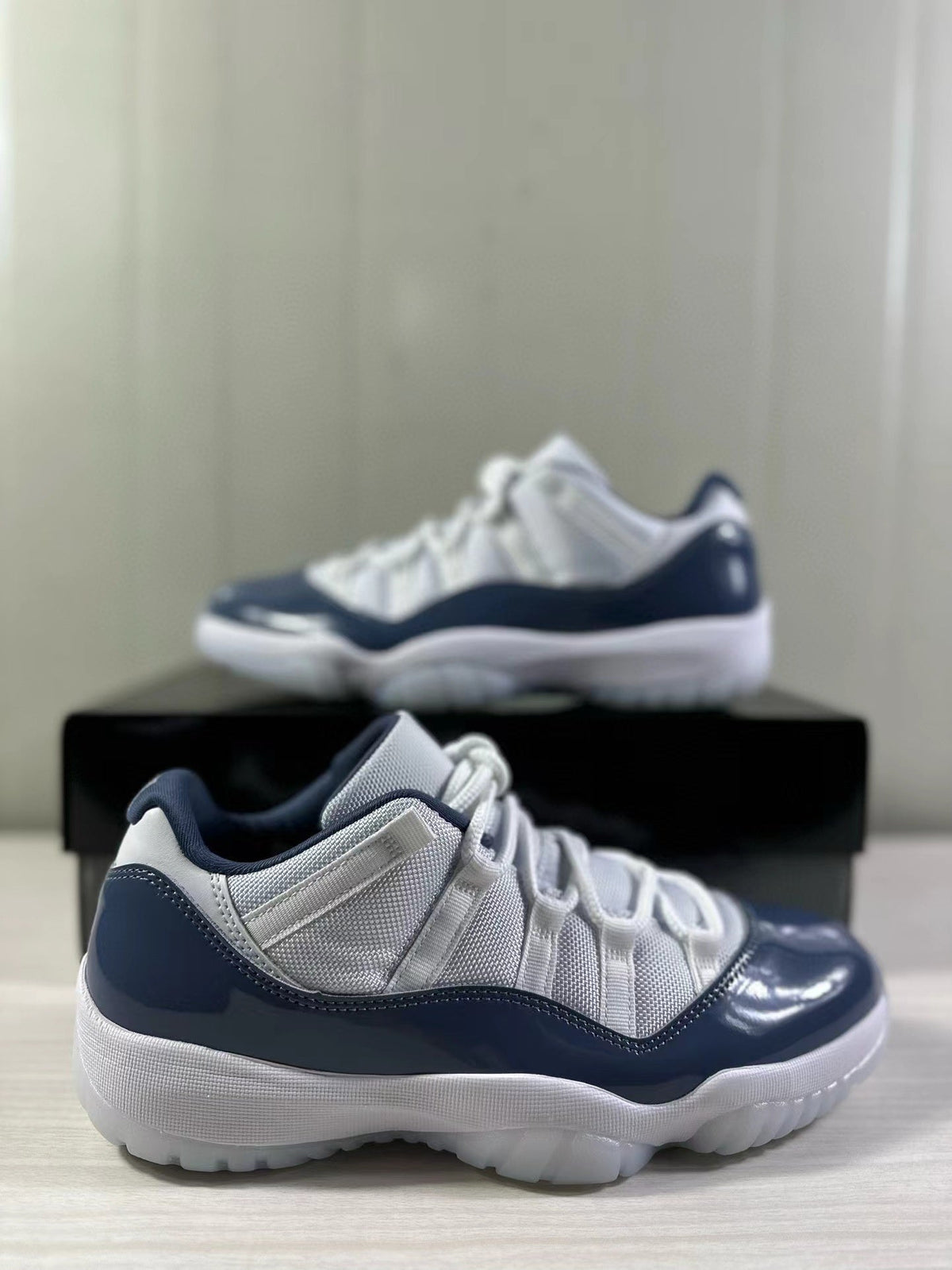 Air Jordan 11 Low Diffused Blue Sneakers FV5104-104 - product image from the listing.