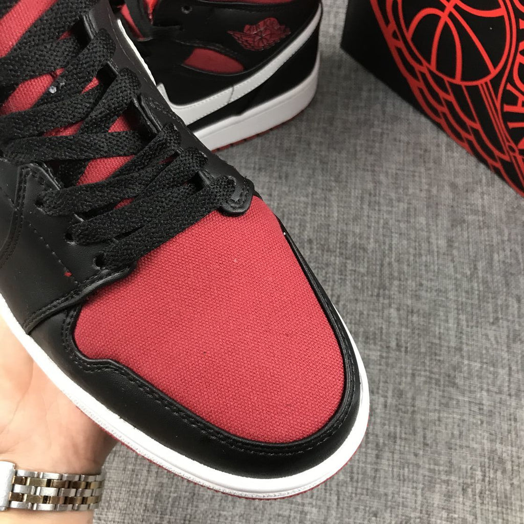 Black Red Canvas-Style Sneakers - Jordan 1 Mid 554724-020 - product image from the listing.