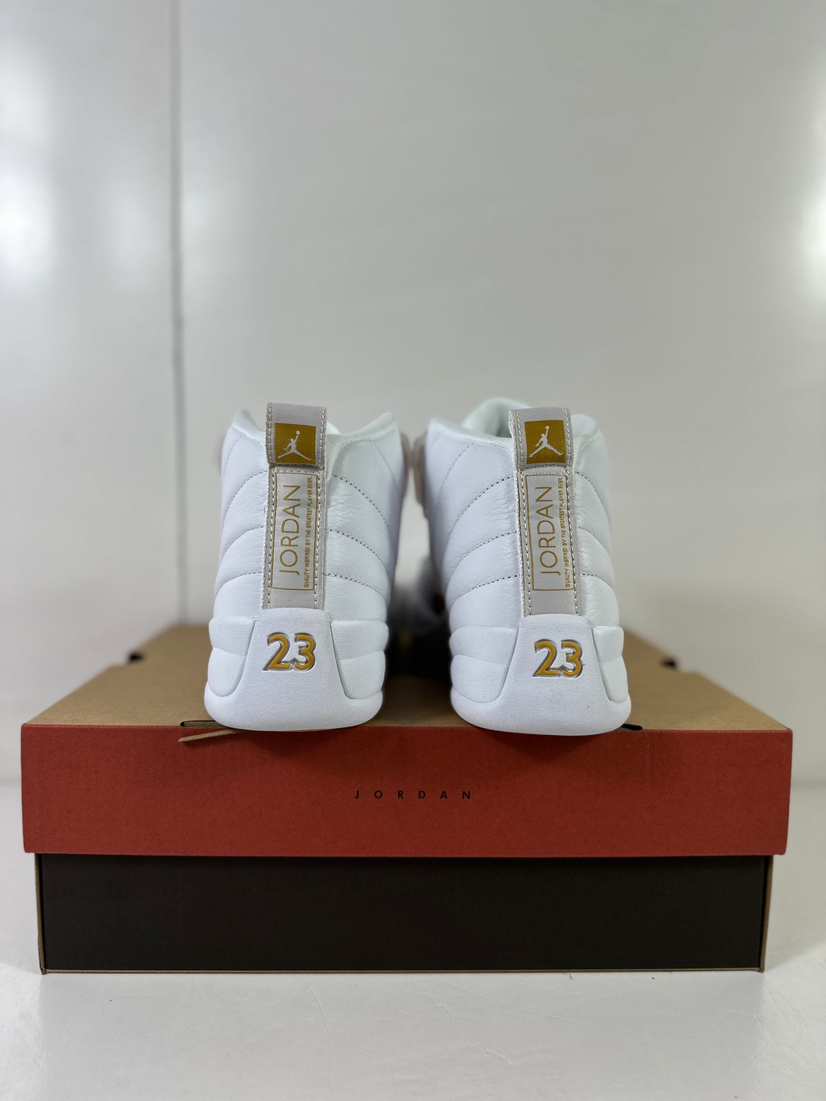 Air Jordan 12 Phantom White Metallic Gold Sneakers FD9101-007 - product image from the listing.