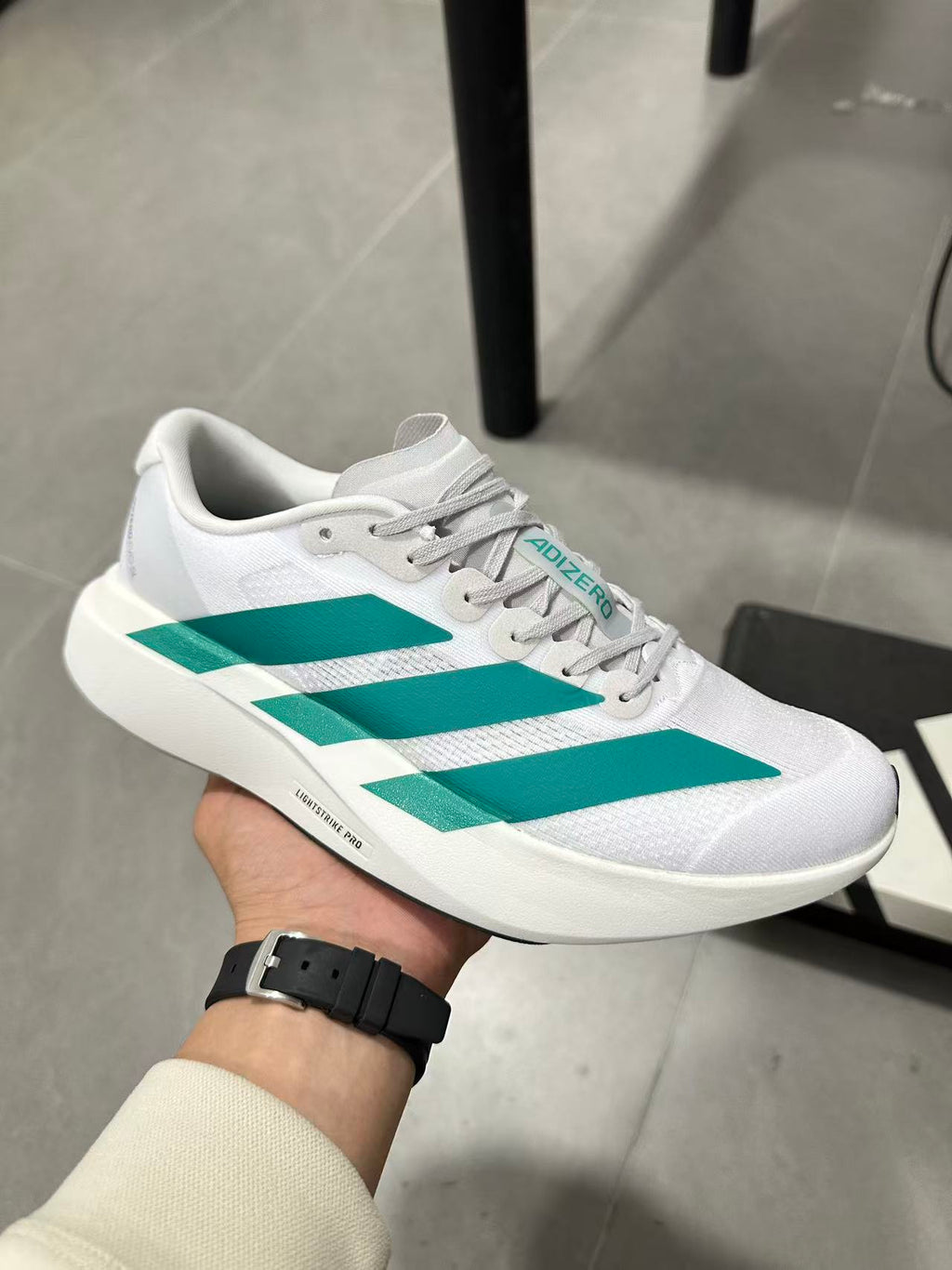 adidas Lightstrike Pro Running Shoes in White and Teal JR4451 - product image from the listing.