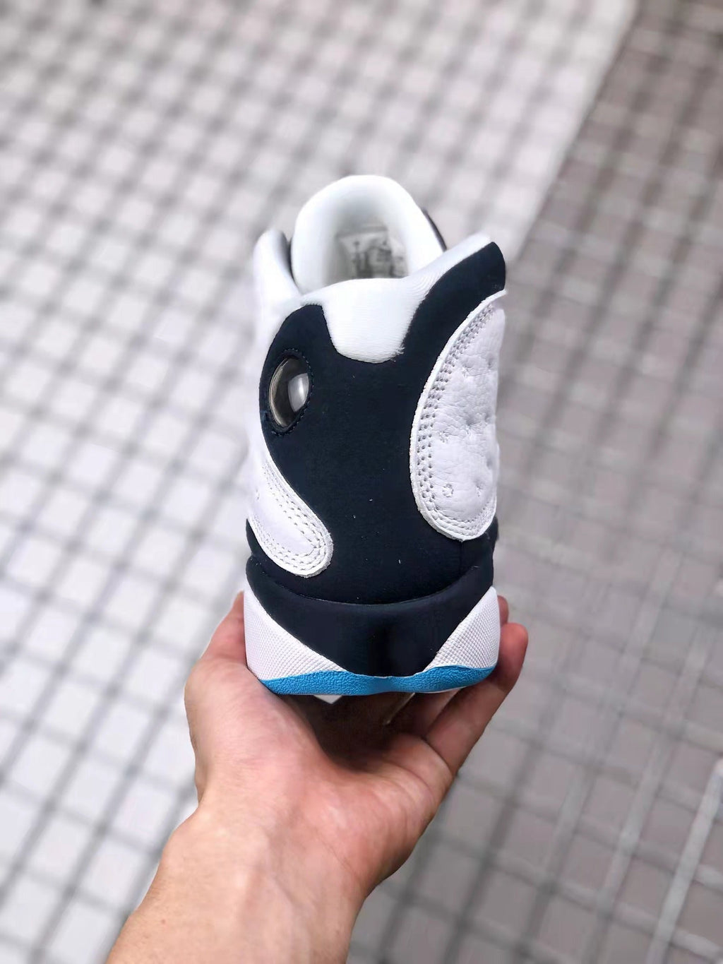 Air Jordan 13 Obsidian Sneakers 414571-144 - product image from the listing.