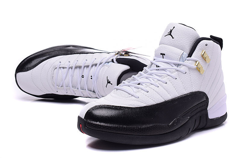 Air Jordan 12 Retro White and Black High-Top Sneakers - product image from the listing.