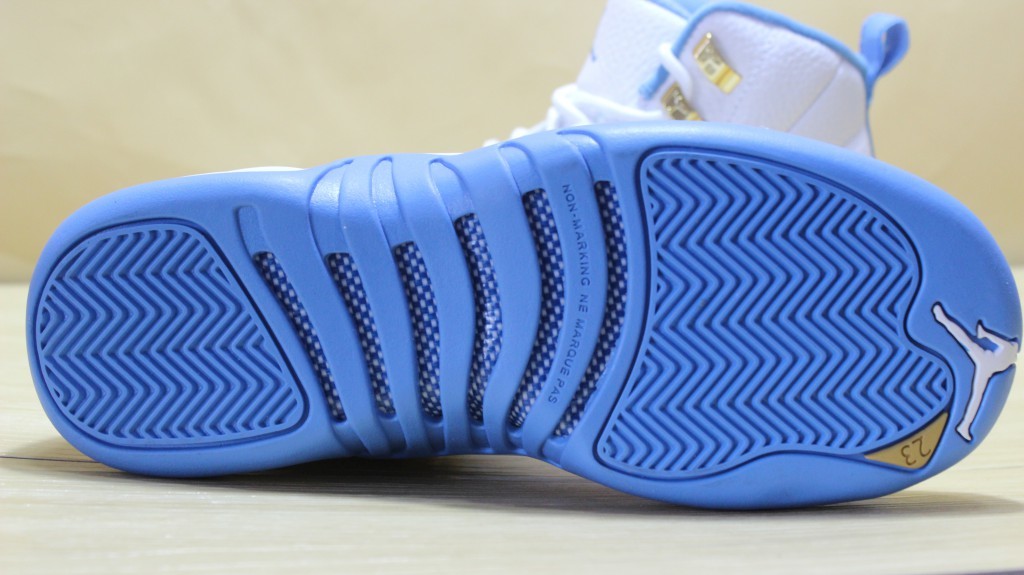 Air Jordan 12 High-Top Sneakers in University Blue 510815-127 - product image from the listing.