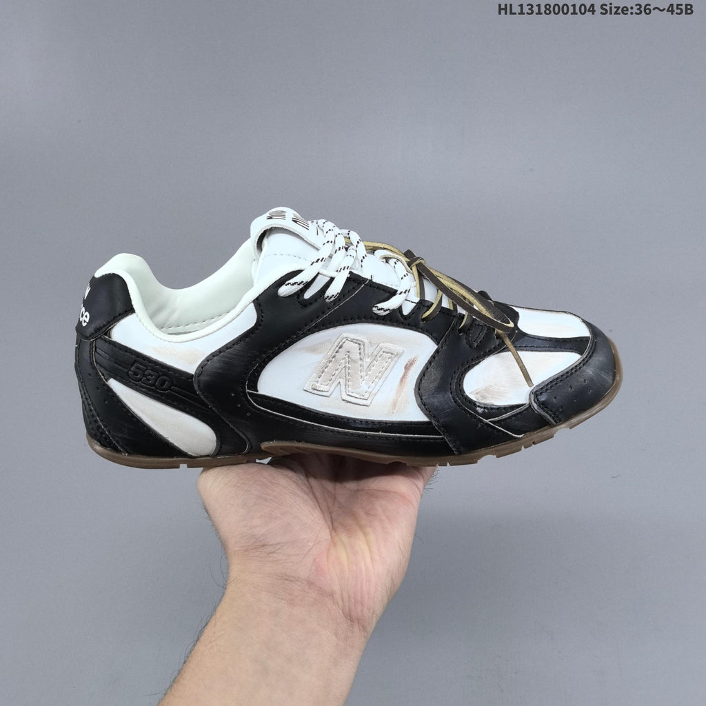 Black and White New Balance 530 SL Low-Top Sneakers - product image from the listing.