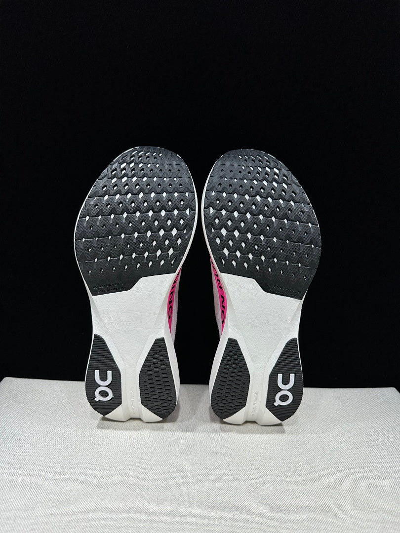 On Cloudboom Strike LS Running Sneakers in White/Pink - product image from the listing.