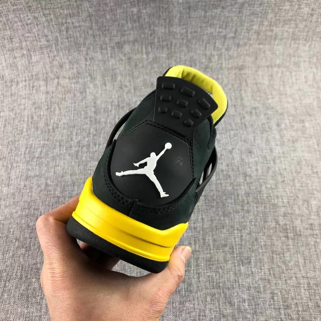 Air Jordan 4 Thunder Black Yellow Sneakers - product image from the listing.