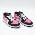 Jordan 1 Low Sneakers in Black Pink White 554723-106 - product image from the listing.