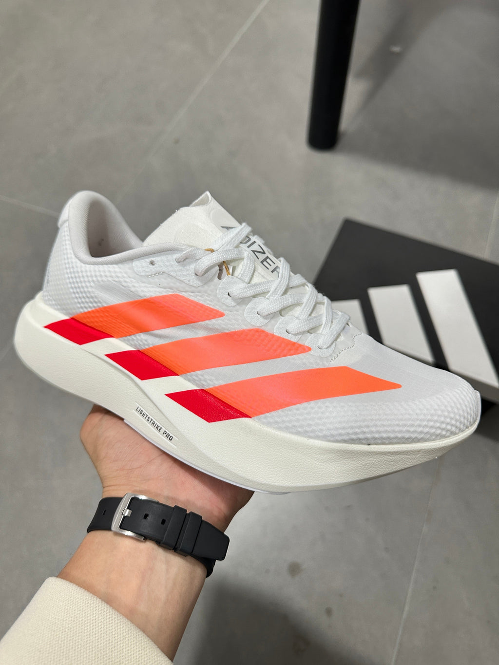 Adidas Adizero EVO SL Running Shoes in White Orange - product image from the listing.