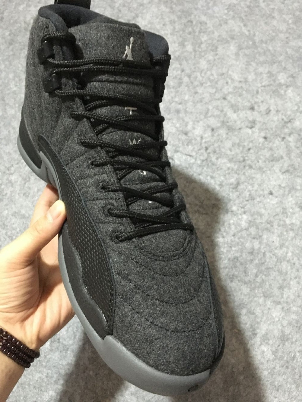 Black and Grey Air Jordan 12 High-Top Sneakers - product image from the listing.