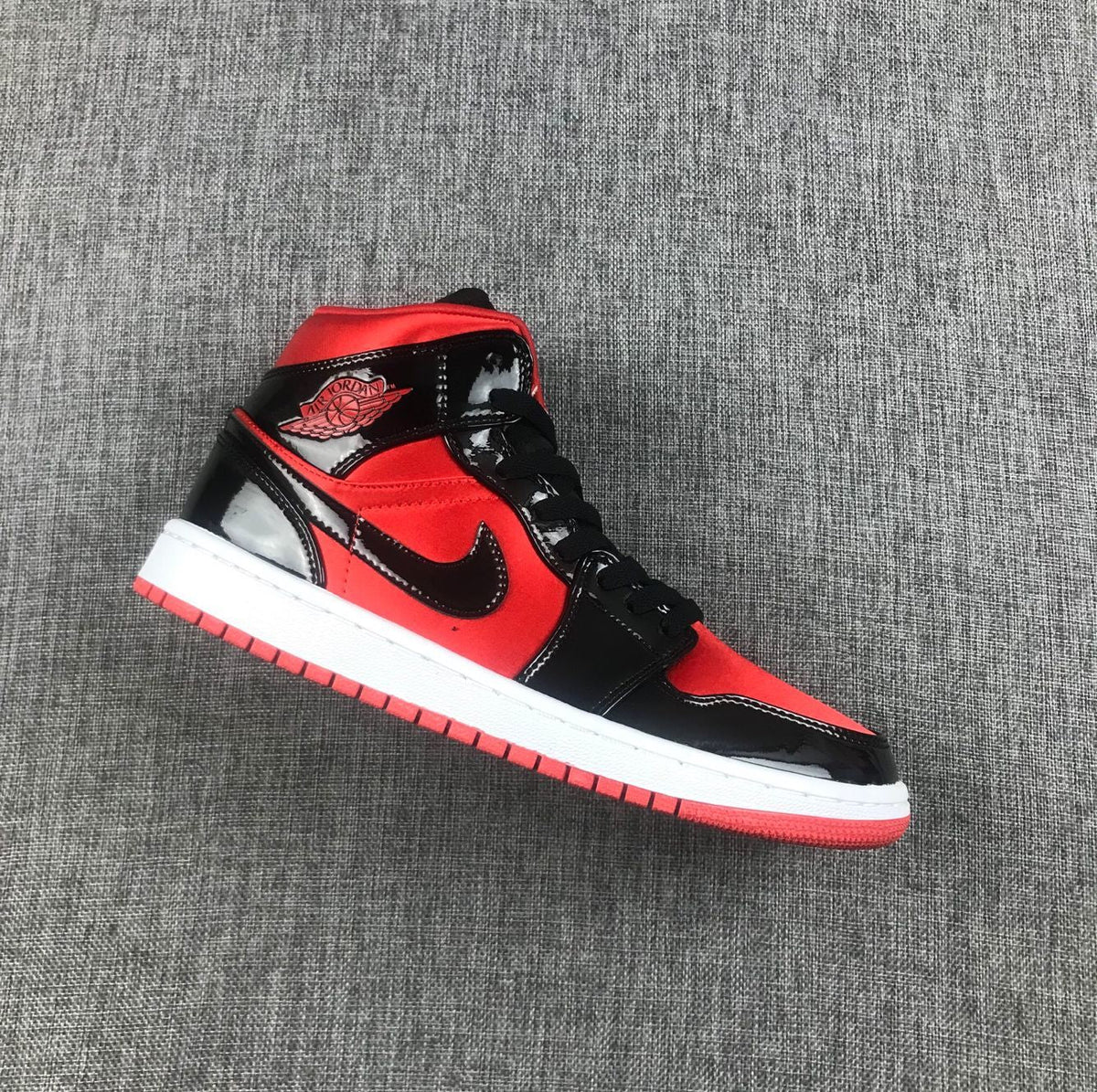 Air Jordan 1 Mid Sneakers in Black Red White BQ6472-600 - product image from the listing.