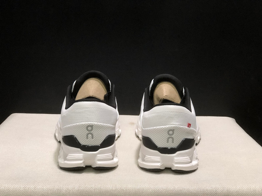 On Cloud X 4 Sneakers in Ivory and Black - product image from the listing.