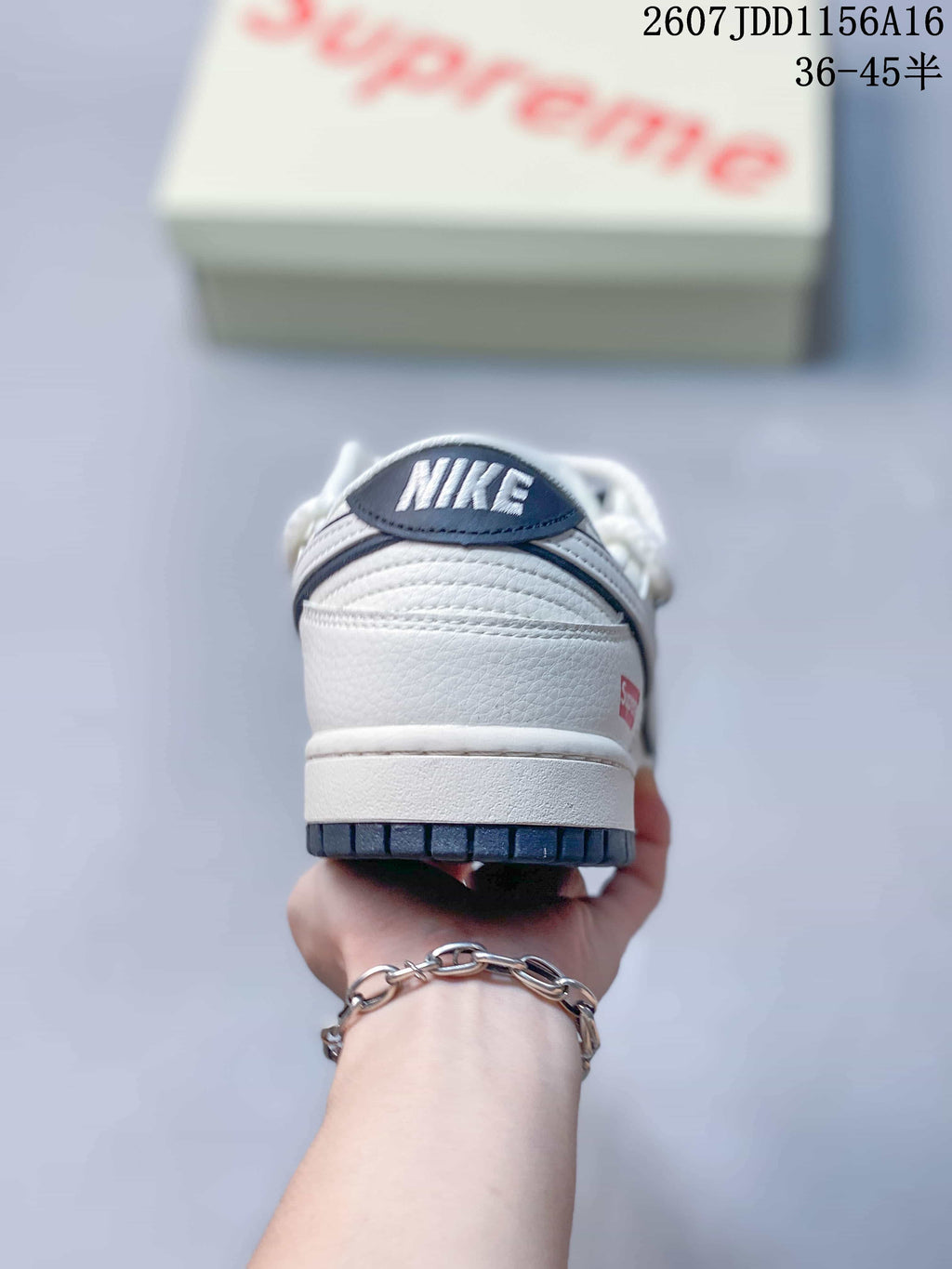 Nike SB Dunk Low Supreme Sneakers in Off-White - product image from the listing.