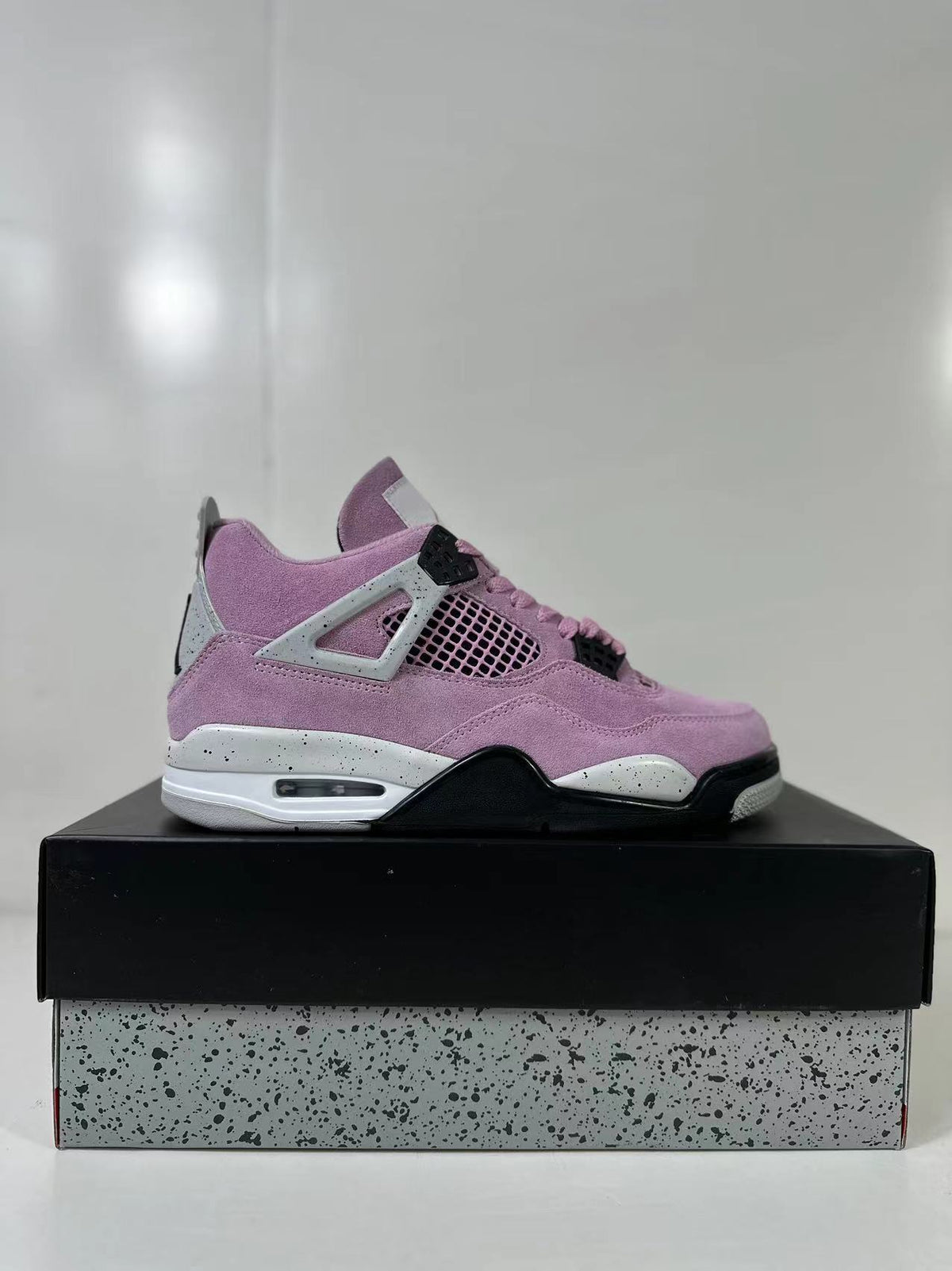 Air Jordan 4 Retro Orchid Pink Sneakers AQ9129-501 - product image from the listing.