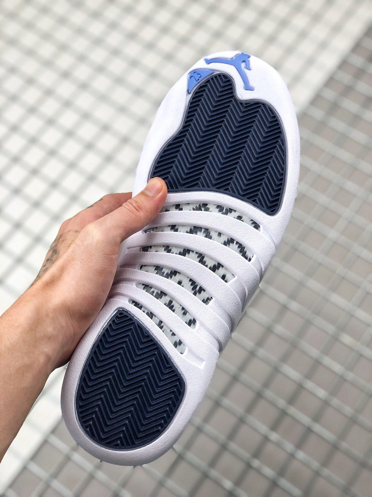 Air Jordan 12 Indigo Sneakers 130690-404 - product image from the listing.
