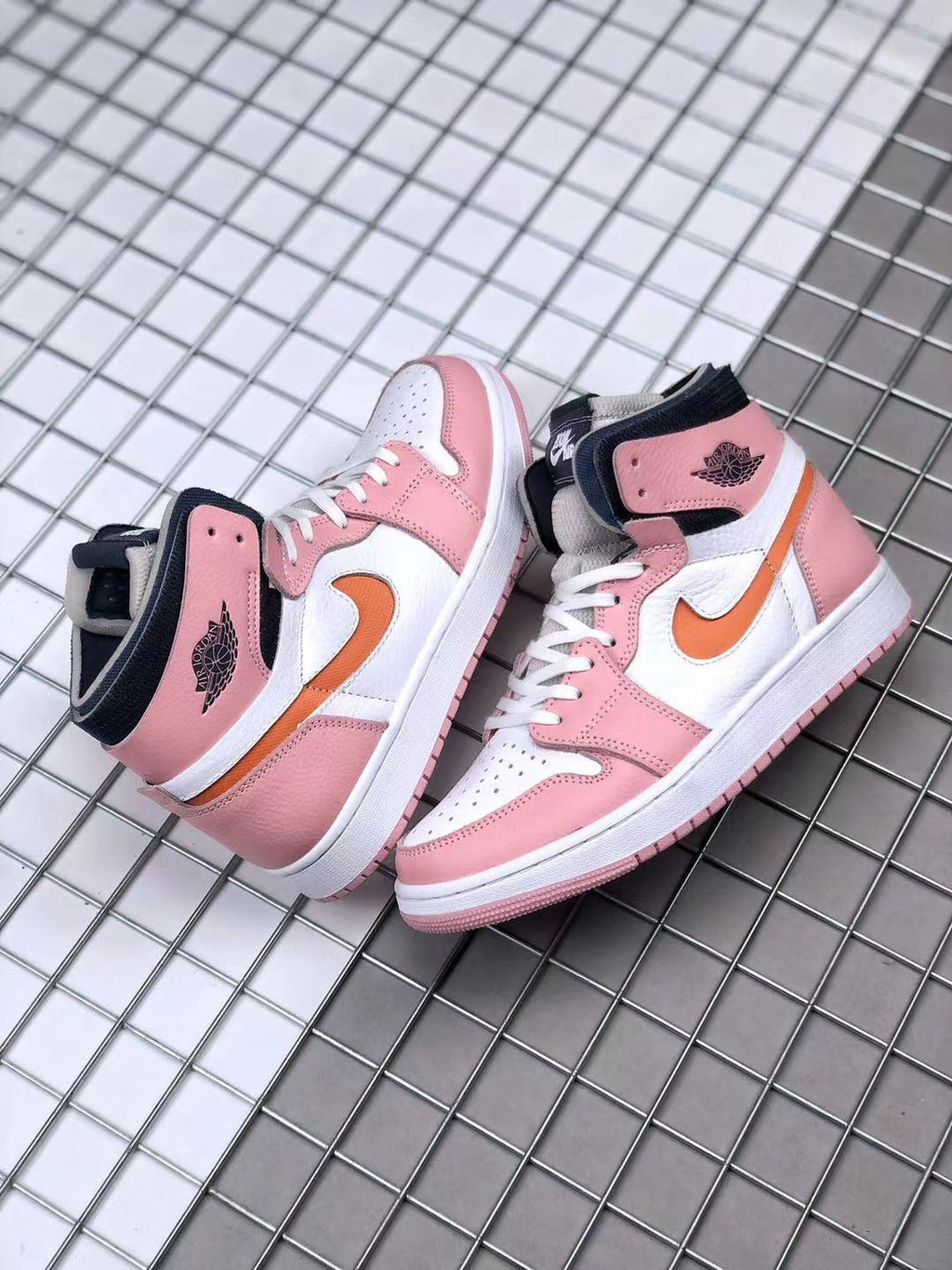 Jordan 1 High Zoom CMFT Sneakers in Pink White Orange CT0979-601 - product image from the listing.