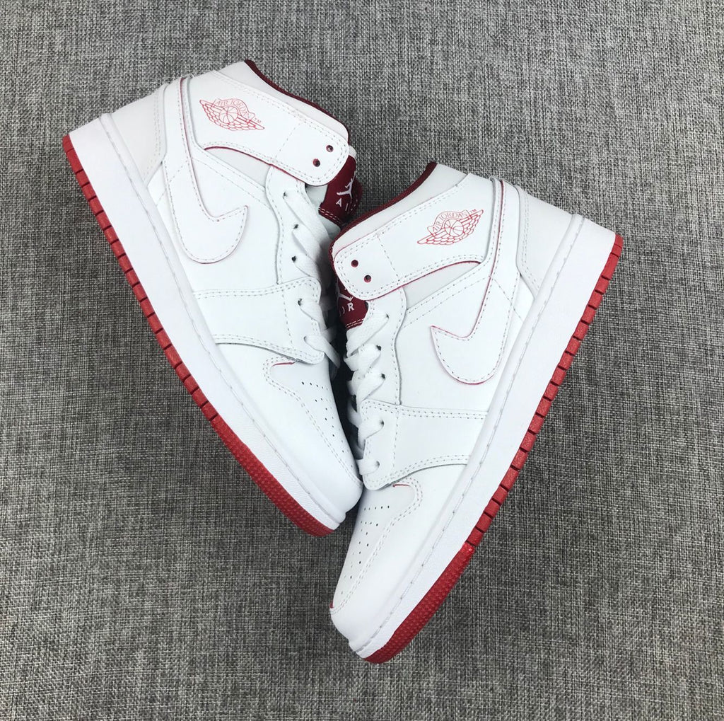 Air Jordan 1 Mid Sneakers in White and Red 554725-103 - product image from the listing.