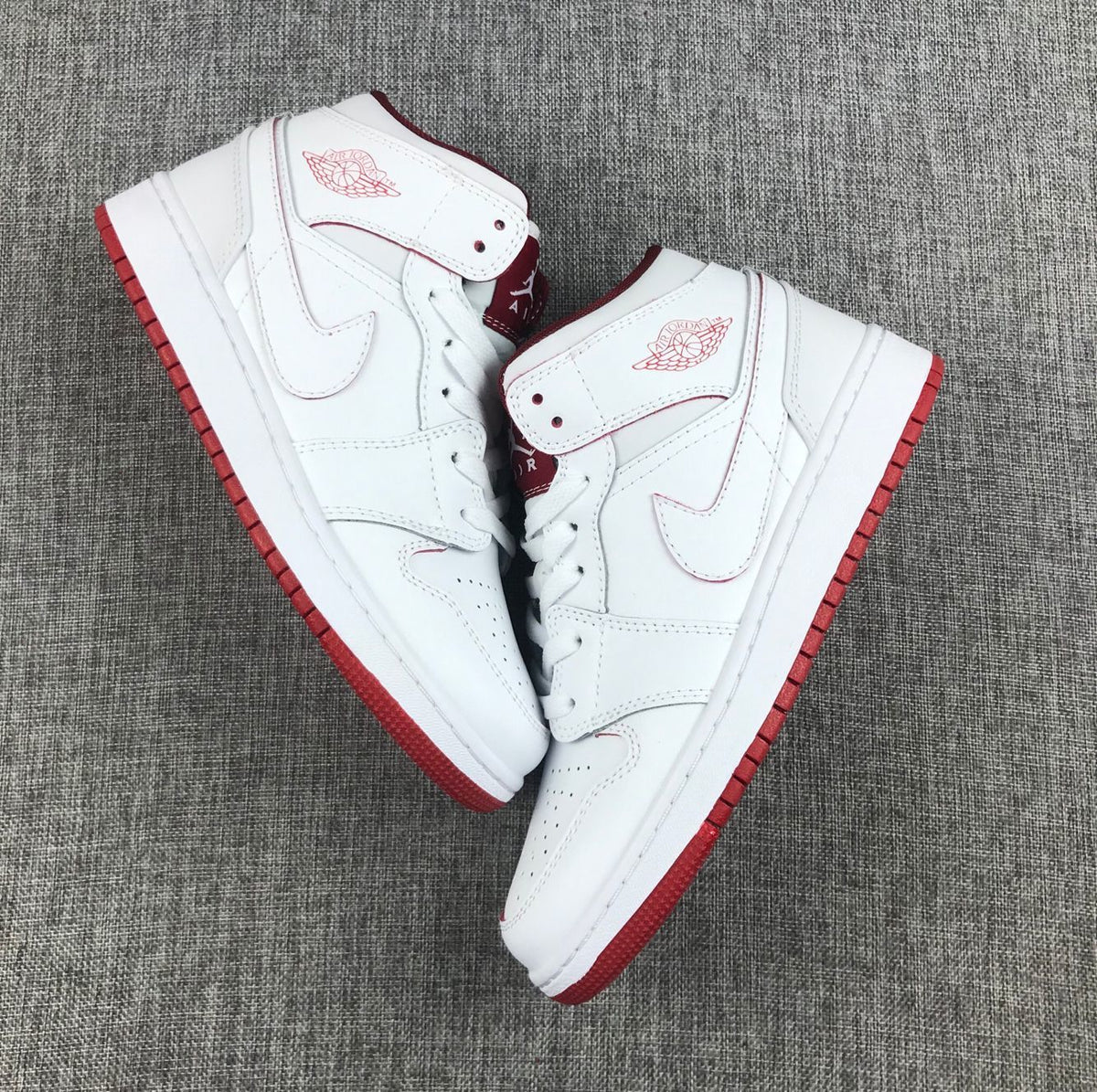 Air Jordan 1 Mid Sneakers in White and Red 554725-103 - product image from the listing.