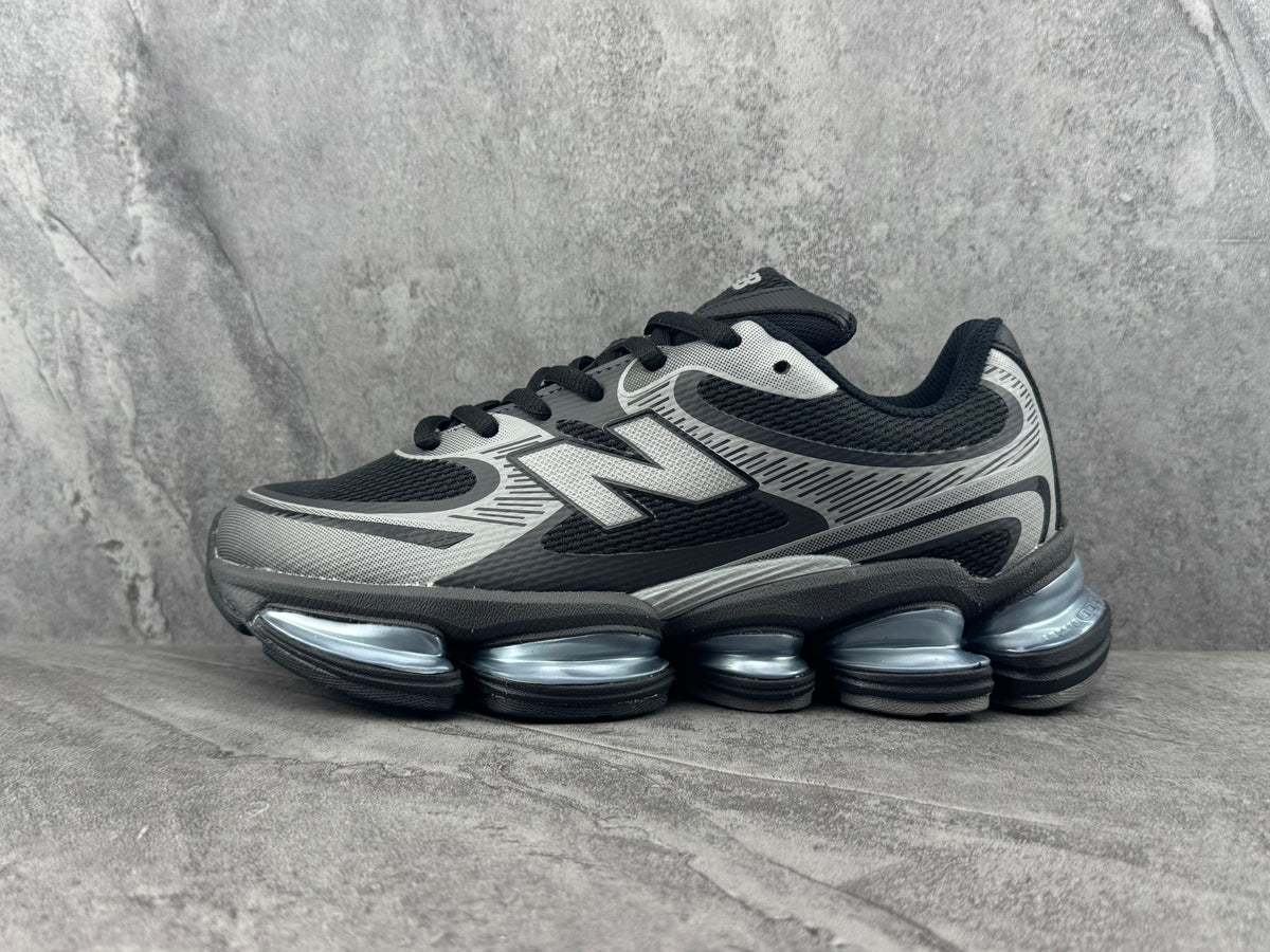 New Balance Black and Silver Running-Inspired Trainers - product image from the listing.