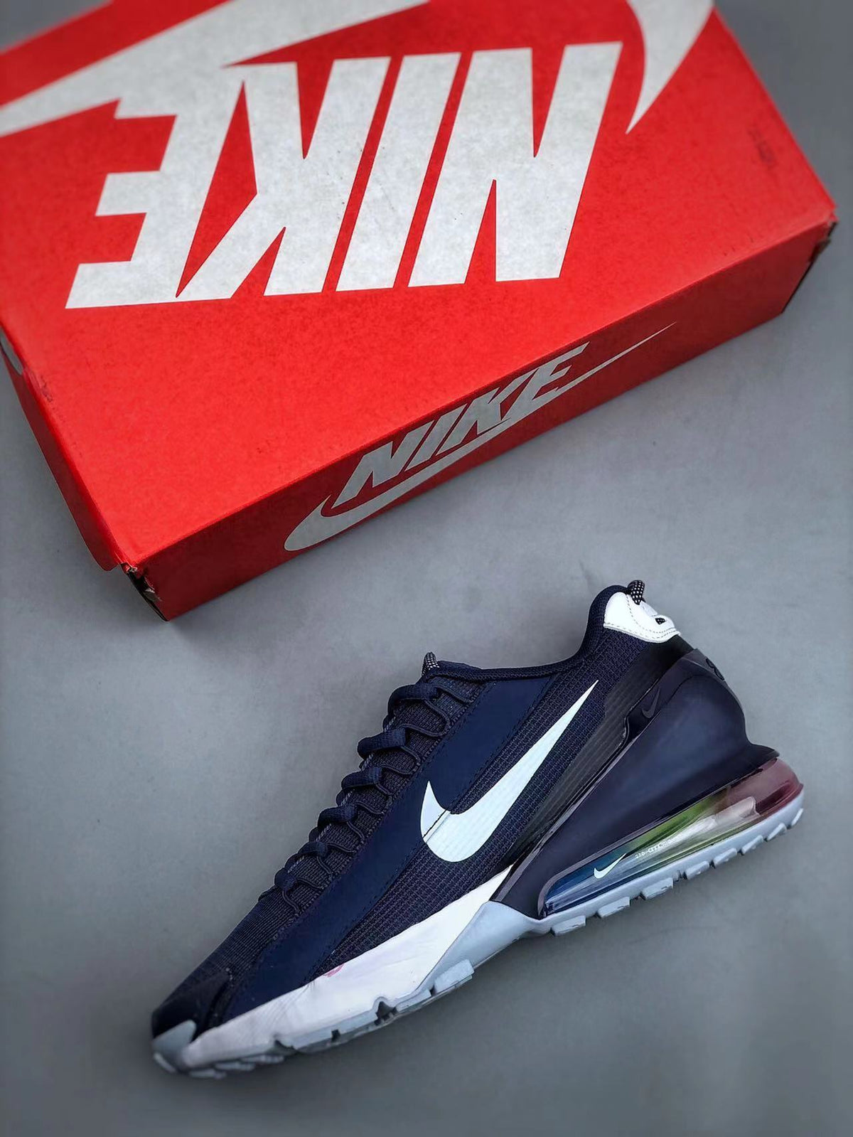 Navy and White Nike Air Max 270 React Sneakers - product image from the listing.