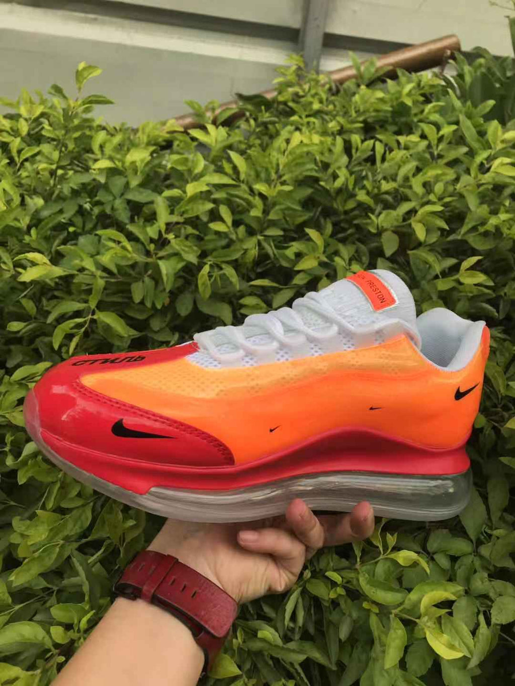 Orange and Red Nike Air Max 720 Sneakers - product image from the listing.