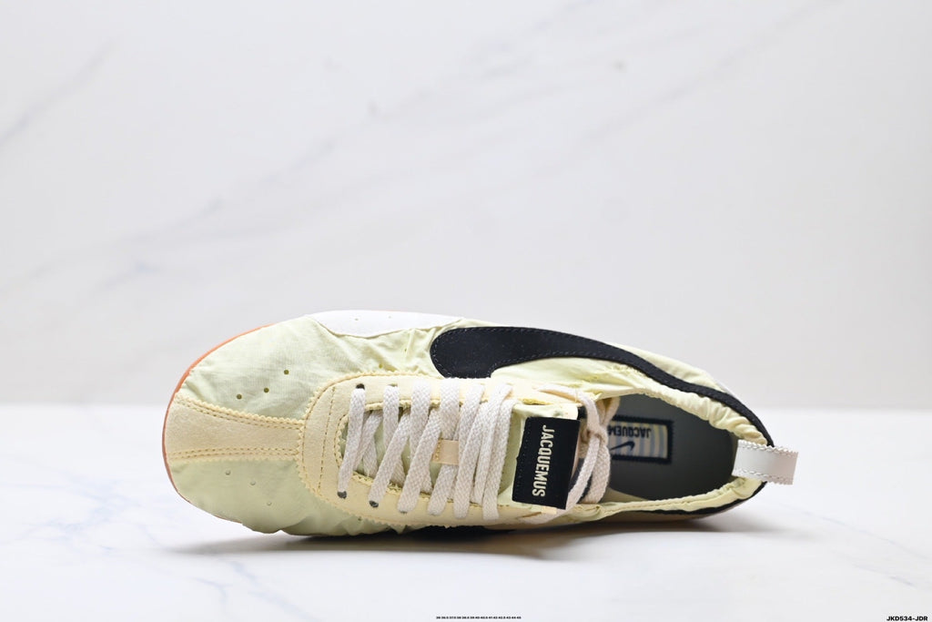 Jacquemus x Nike Jacumoon Sneakers, in Light Yellow and Black - product image from the listing.