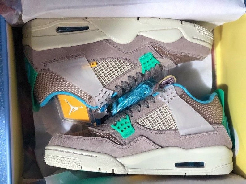 Air Jordan 4 Retro Gray Teal Sneakers - product image from the listing.