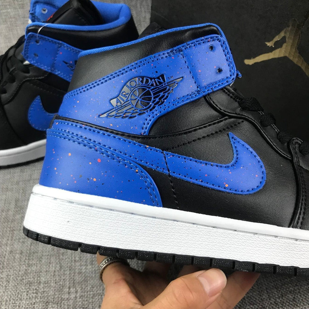 Air Jordan 1 Mid High-Top Sneakers in Black and Blue - product image from the listing.