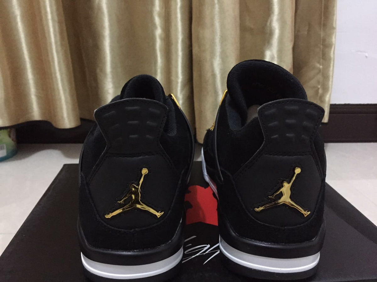 Jordan 4 High-Top Sneakers in Black and Gold - product image from the listing.