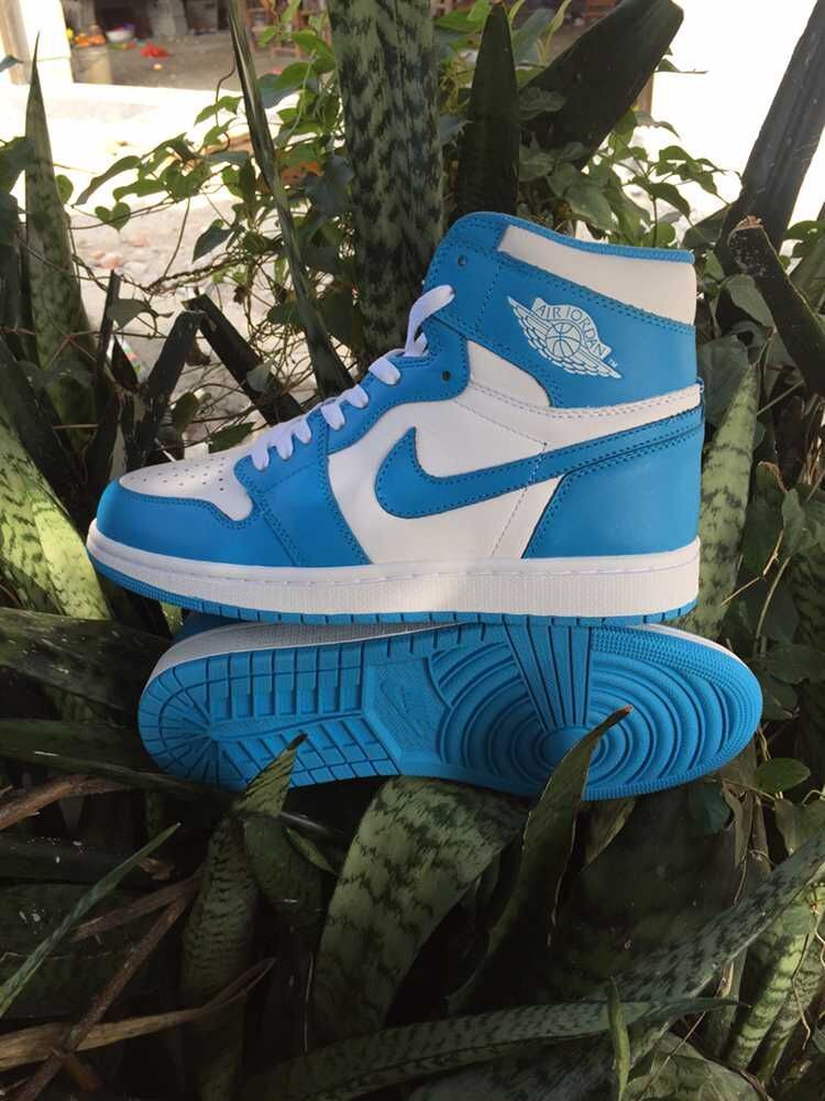 Blue and White Air Jordan 1 High Sneakers - product image from the listing.