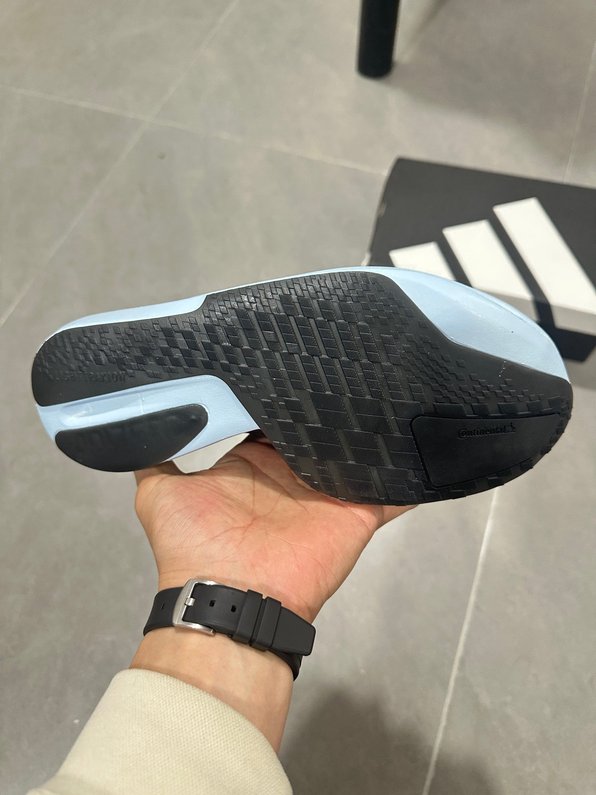 adidas Adizero Adios Pro Running Shoes, in Light Blue and Black - product image from the listing.