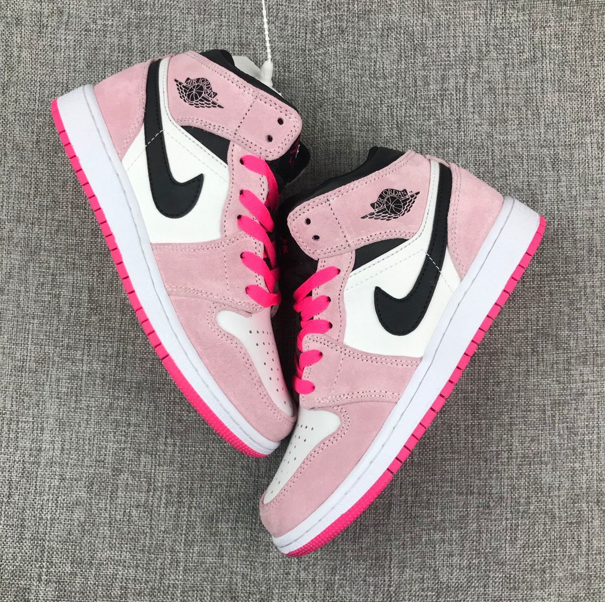 Jordan 1 Mid Sneakers in Pink White Black 852542-801 - product image from the listing.