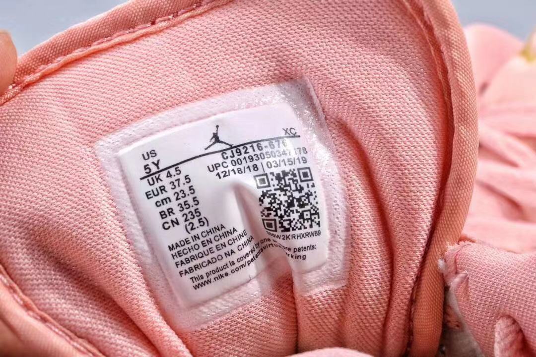 Women's Jordan 1 Low Pink and Gold Sneakers - product image from the listing.