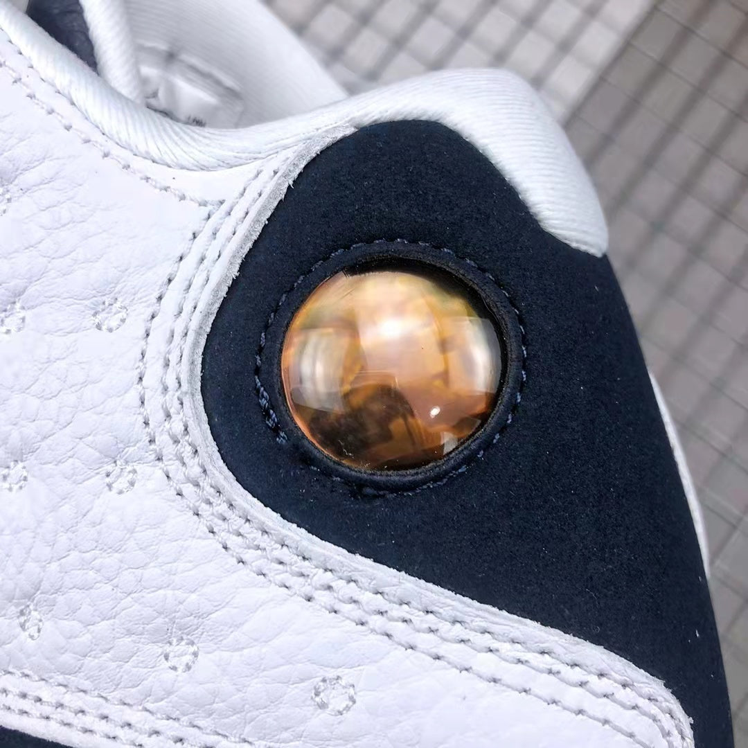 Air Jordan 13 Obsidian Sneakers 414571-144 - product image from the listing.