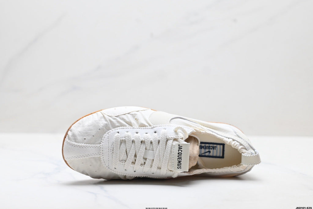 White Jacquemus x Nike Jacumoon Sneakers - product image from the listing.