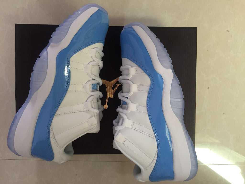 White and University Blue Jordan 11 Low Sneakers - product image from the listing.