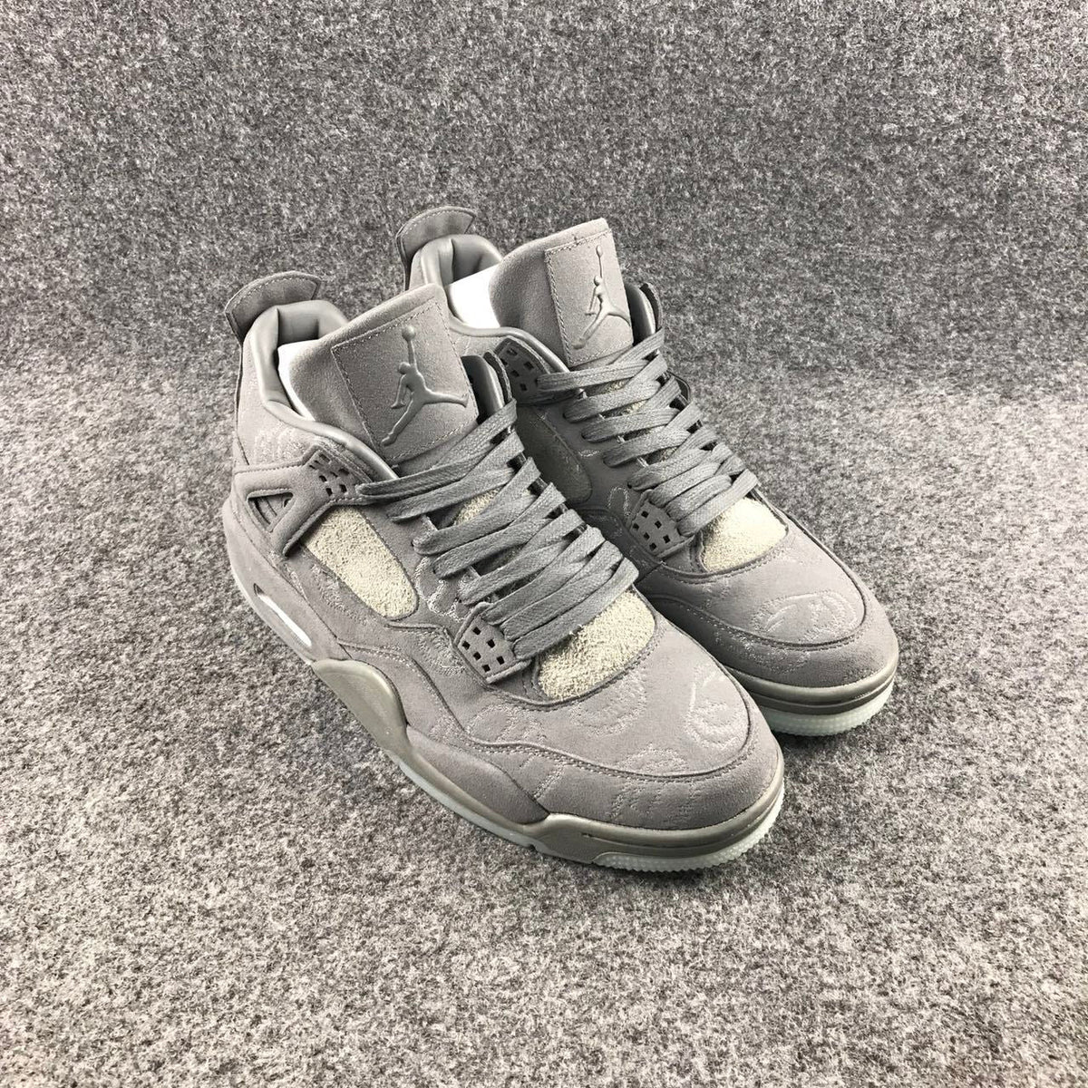 Grey Jordan 4 KAWS Sample High-Top Sneakers - product image from the listing.