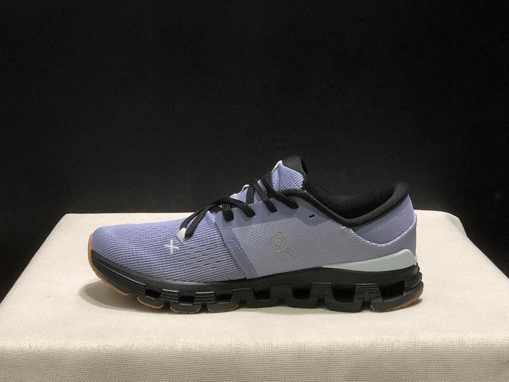 On Cloud X 4 Sneakers in Feather in Black - product image from the listing.