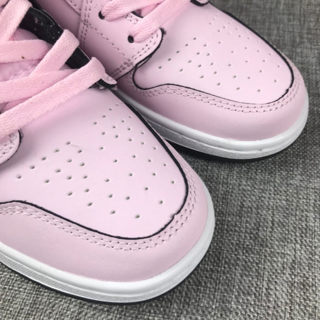 Air Jordan 1 Mid High-Top Sneakers in Pink and Black - product image from the listing.