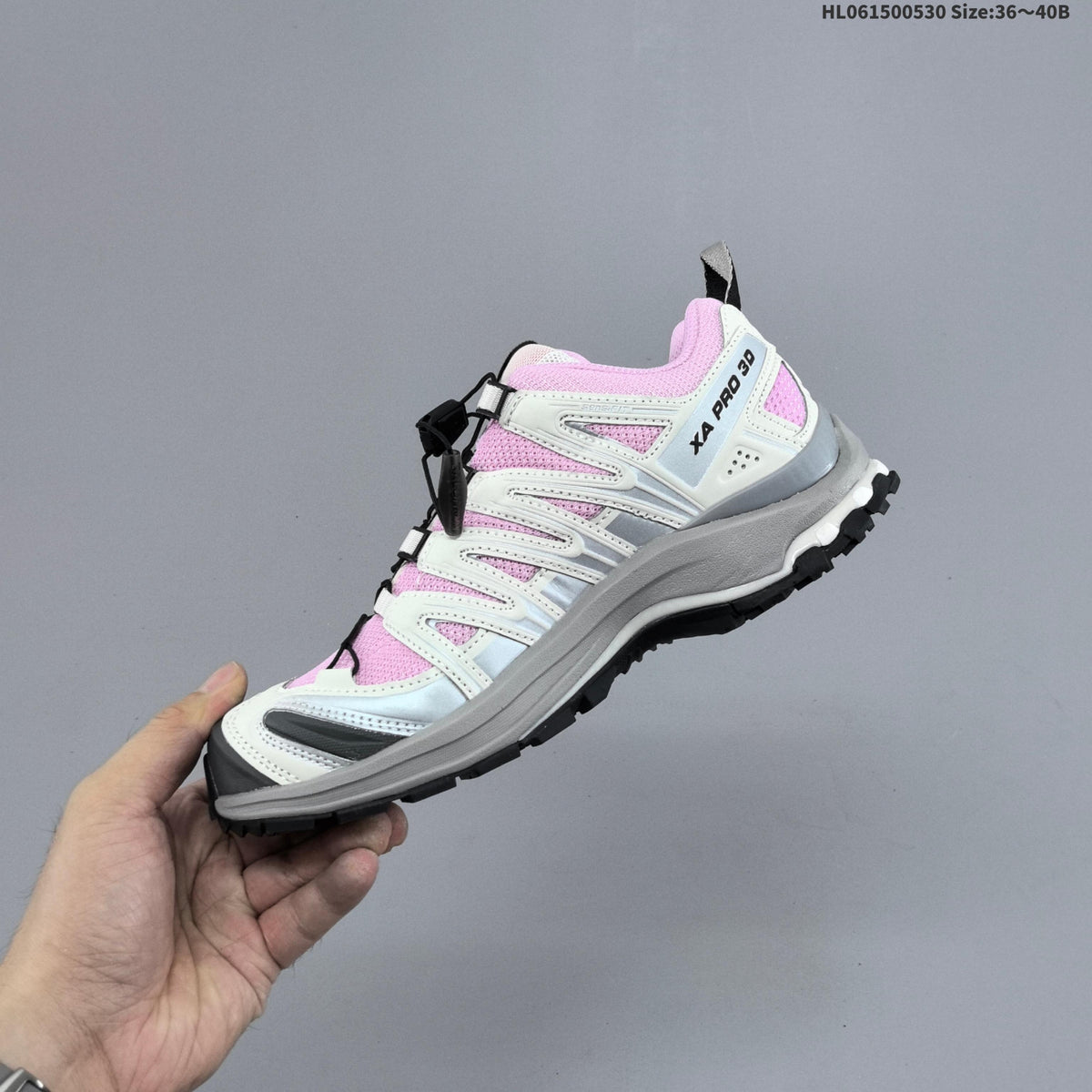 Pink and White Salomon XA PRO 3D Trail Running Shoes - product image from the listing.