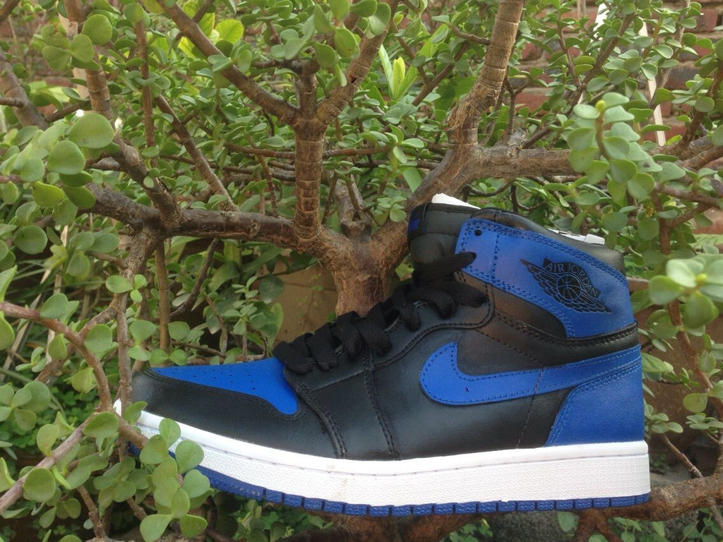 Jordan 1 High Basketball Sneakers in Blue and Black - product image from the listing.