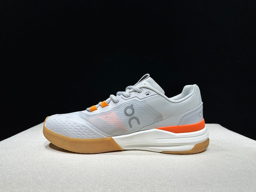 On THE ROGER Advantage Pro Tennis Shoes, in Grey and Orange - product image from the listing.