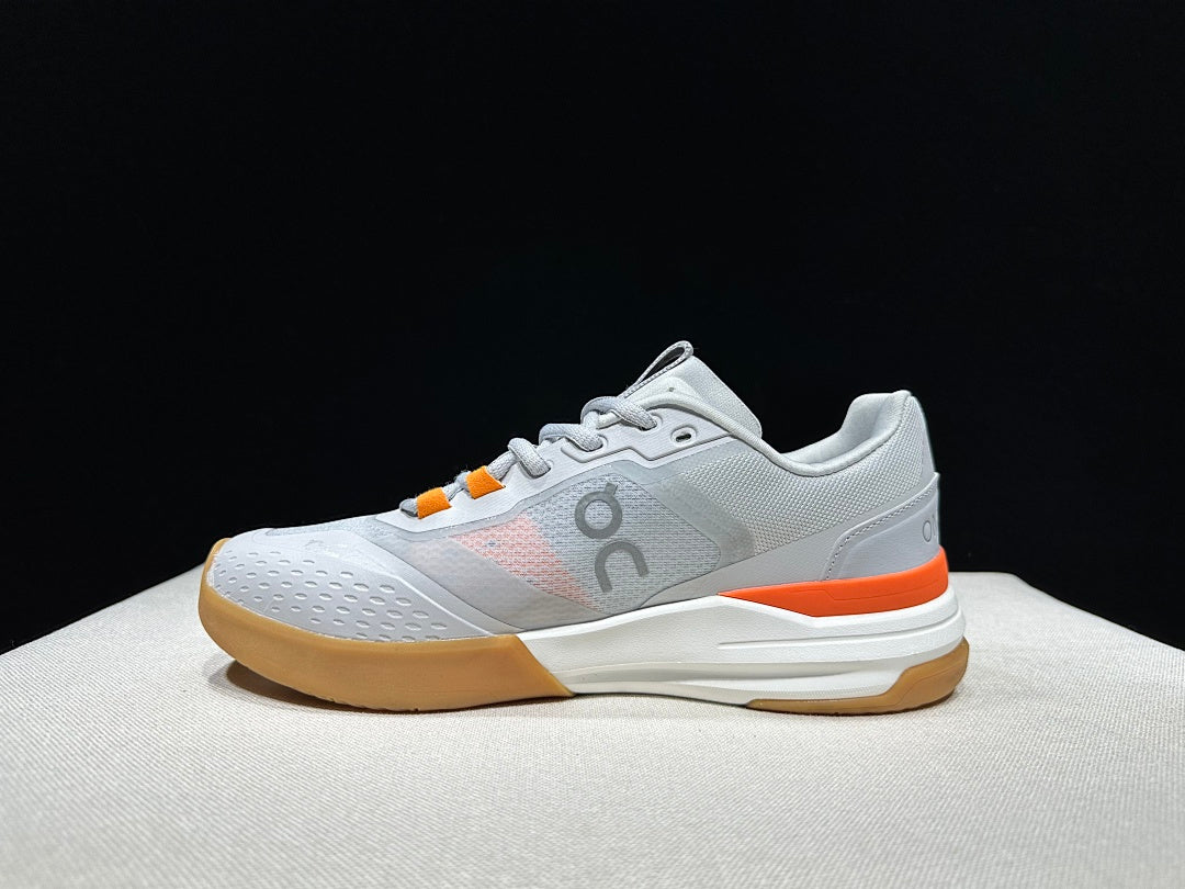 On THE ROGER Advantage Pro Tennis Shoes, in Grey and Orange - product image from the listing.