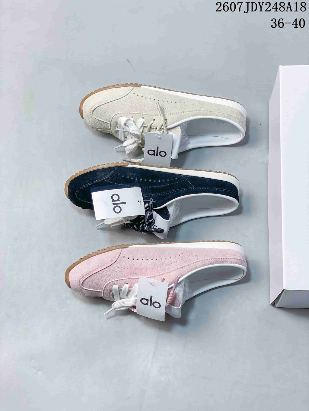 alo Sunset Mule Sneakers in Pink, in Navy and Cream - product image from the listing.