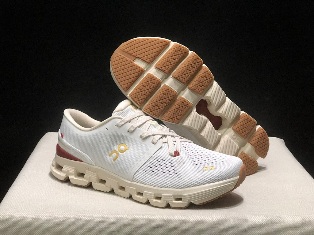 On Cloud X 4 Year of the Snake Sneakers in Ivory Cream - product image from the listing.