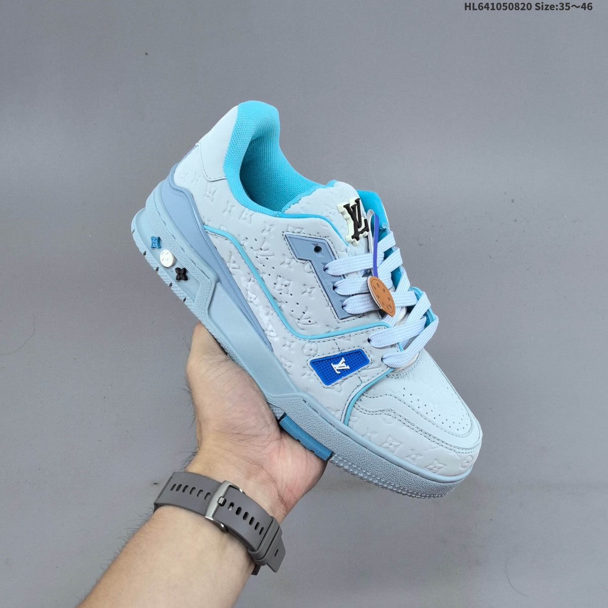 Louis Vuitton Trainer Low-Top Sneakers, in White and Green/Blue - product image from the listing.