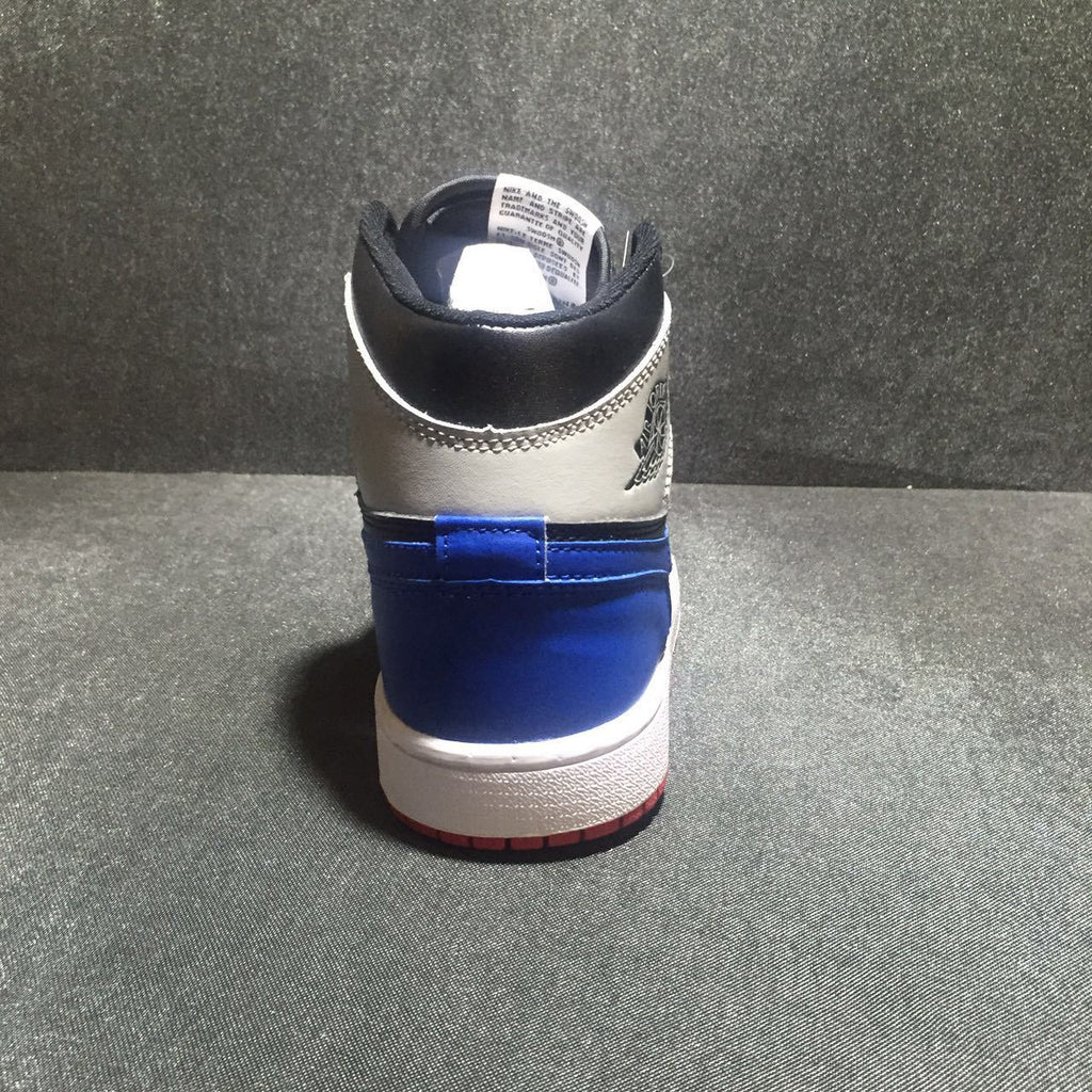 Jordan 1 High Three-Color Sneaker in Black, in Blue and Red - product image from the listing.